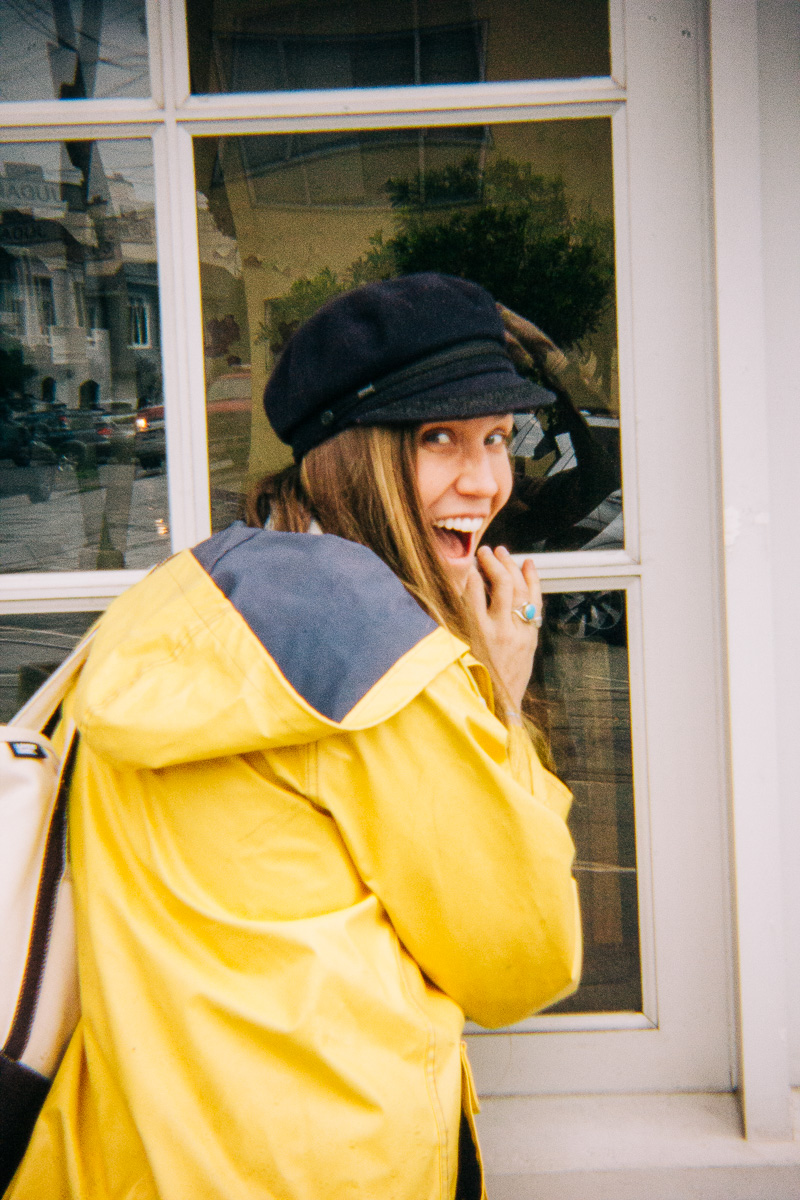 a woman in a yellow raincoat